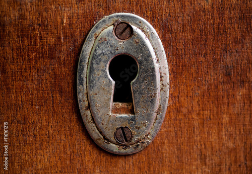 Vintage rusty keyhole closeup shot photo