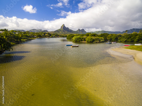 Top down aerial view of Black River Tamarin - Mauritius beach. Curepipe Black River Gorge National Park in background photo