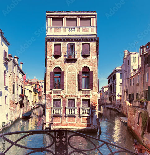 Old houses and waterways in central Venice in Italy photo