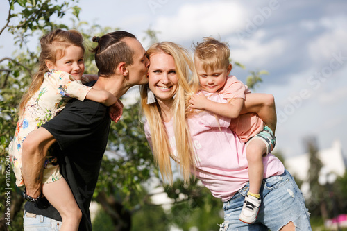 Happy family with children outdoors