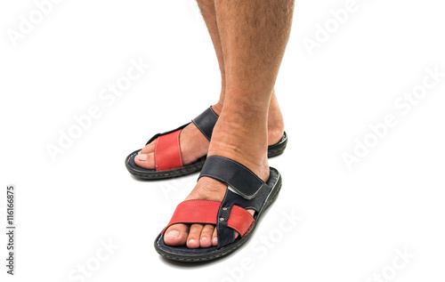 Men's feet in leather sandals