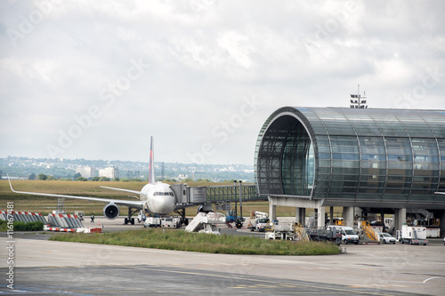 PARIS, FRANCE - JUNE 17 2016 - paris airport landing and loading cargo and passenger photo