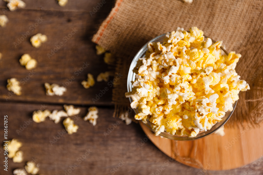 Salt popcorn on the wooden table Salt popcorn on the wooden table