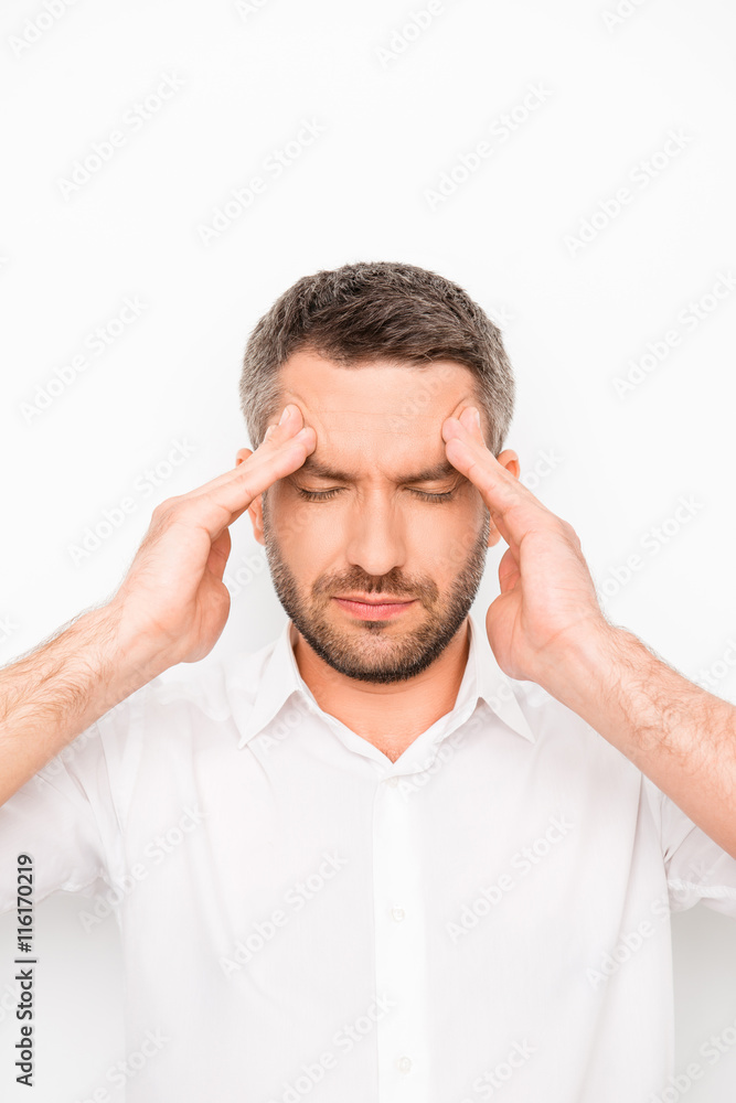 Portrait of sick unhappy businessman having strong headache Portrait of sick unhappy businessman having strong headache