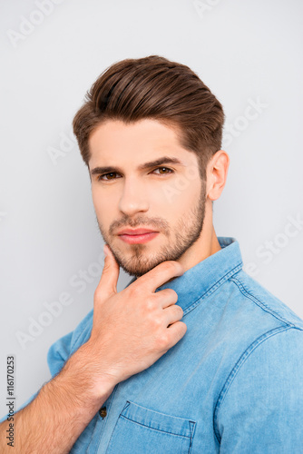 handsome minded young man in glasses think