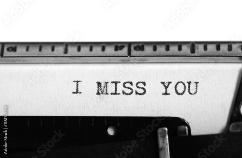 Typewriter. Typing text: i miss you