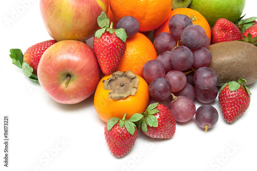 fresh juicy fruits and berries close-up on a white background