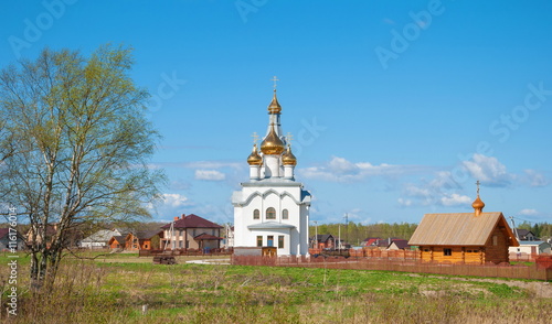 Russian rural landscape with white church