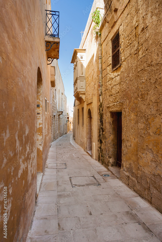 Ancient narrow street in Mdina, old capital of Malta.