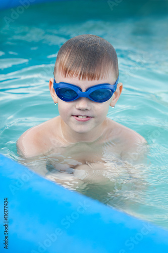 Little boy having fun in the water pool © Ipeku Forp