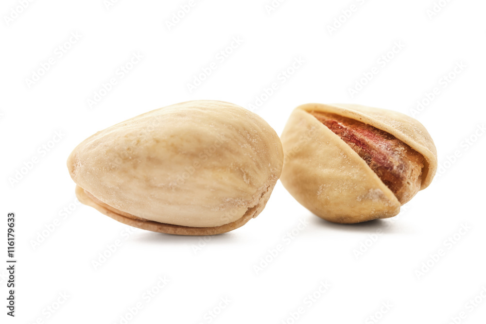 Toasted pistachios on white background Toasted pistachios on white background