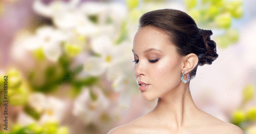 close up of beautiful woman face with earring close up of beautiful woman face with earring