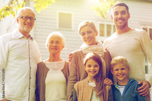 happy family in front of house outdoors