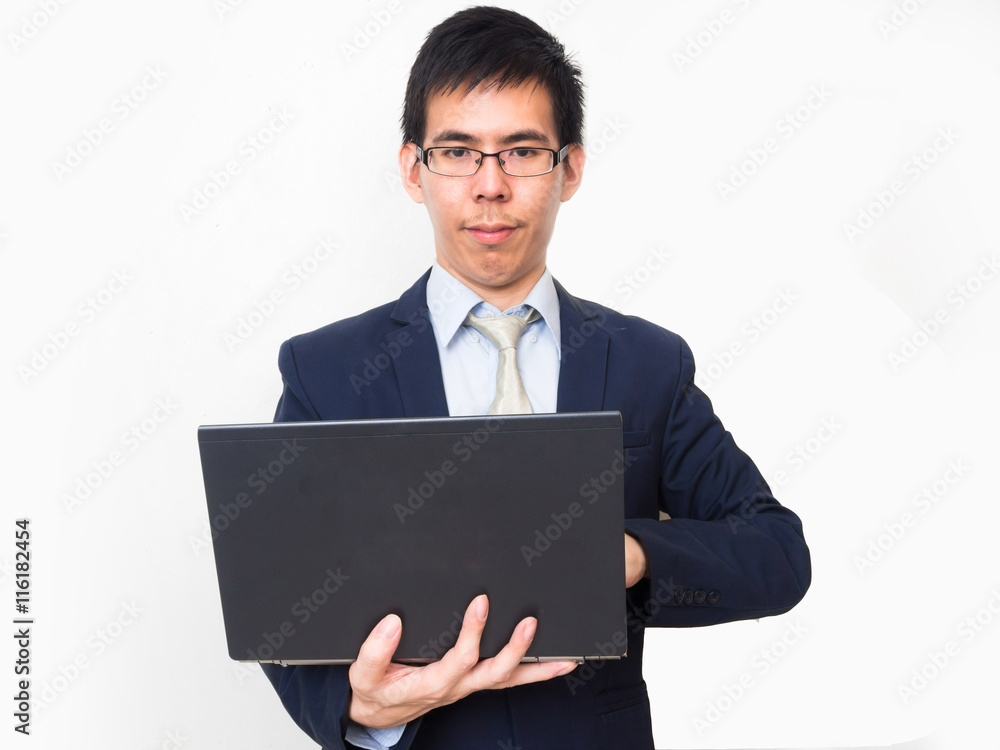 Asian business man wear glasses on professional suit with a lapt Asian business man wear glasses on professional suit with a lapt