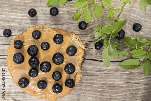 toast of white bread with peanut butter and blueberries