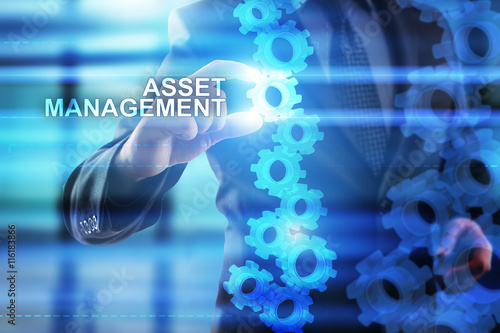 Businessman is selecting "Asset management" on the virtual screen.