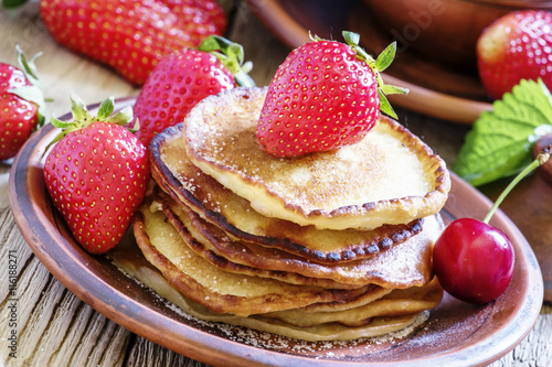 Homemade pancakes with fresh strawberries  selective focus