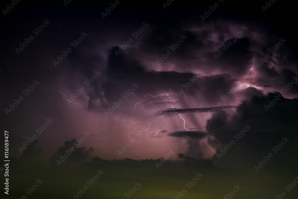 Blur and soft focus night sky with lightning and storm in city,Bangkok,Thailand.(Selective focus)