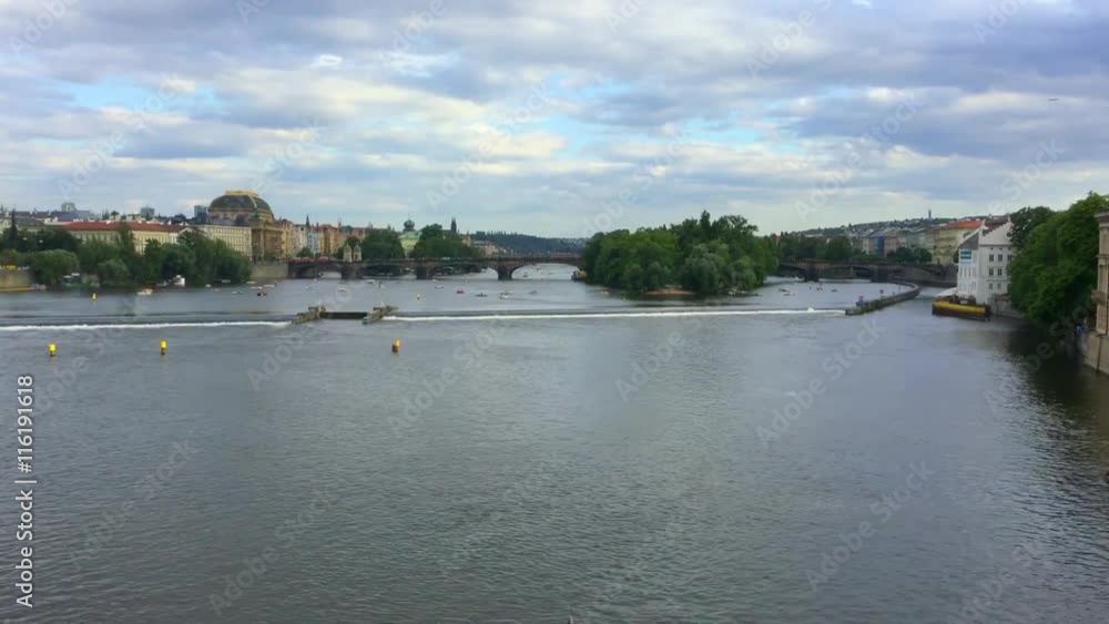 Trip boat on the Vltava river with Charles bridge in background in the real time Trip boat on the Vltava river with Charles bridge in background in the real time