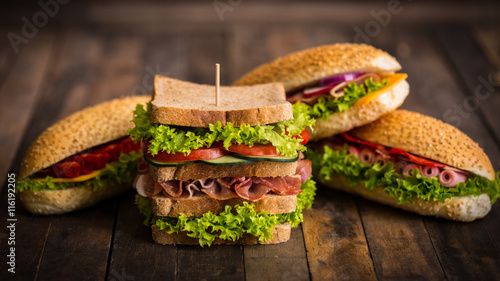Sandwiches with ham and cheese on the table 
