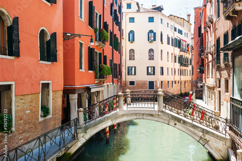 Scenic canal with colorful buildings in Venice, Italy.