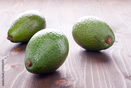 three ripe avocado on the table