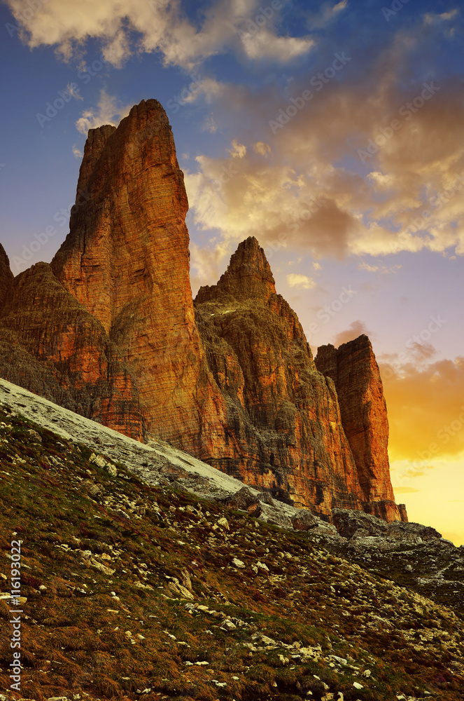 Mountain landscape at sunset. Drei Zinnen or Tre Cime di Lavaredo, Sextener Dolomiten, Italian Alps