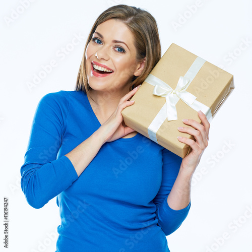 Smiling girl holding paper gift box.
