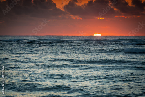 Sunrise sunset above the ocean
