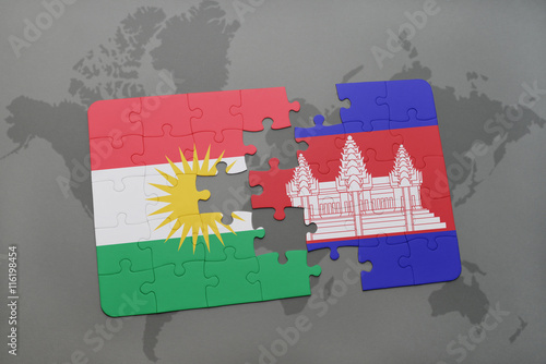 puzzle with the national flag of kurdistan and cambodia on a world map background.