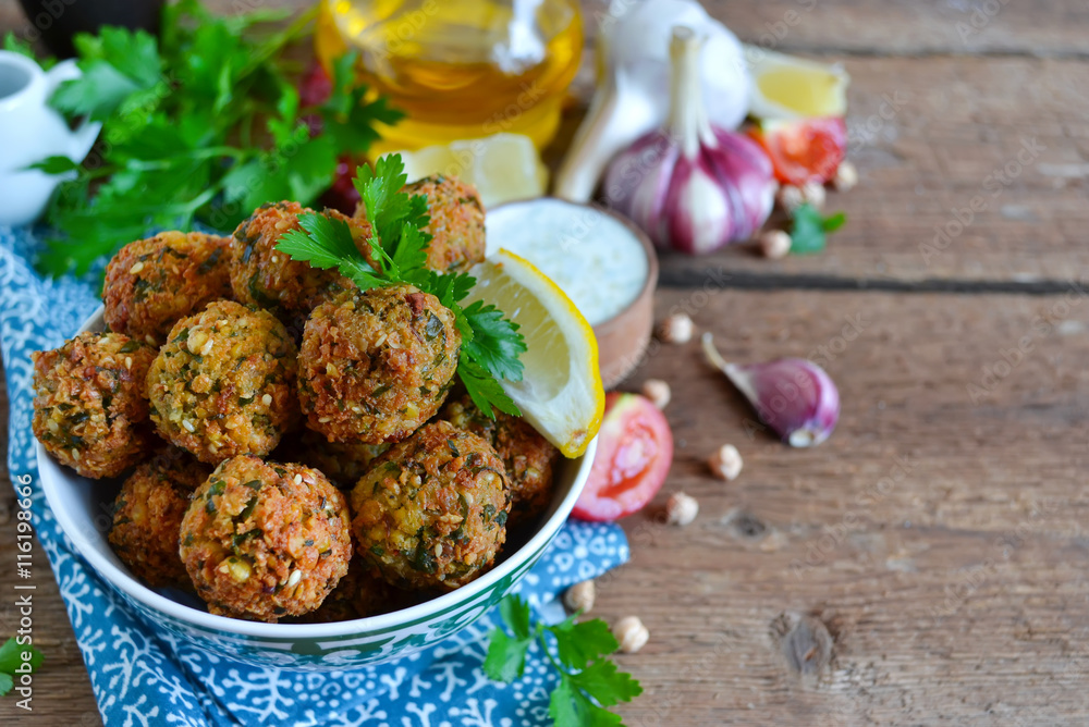 Falafel - deep fried balls of ground chickpeas with tahini sauce Falafel - deep fried balls of ground chickpeas with tahini sauce