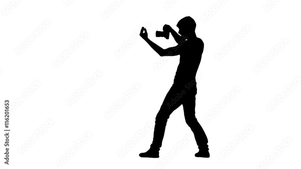 Photographer in process calls up someone and showing approval gesture Photographer in process calls up someone and showing approval gesture