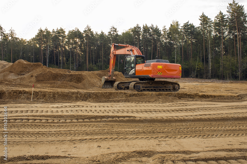 Obraz premium heavy organge excavator