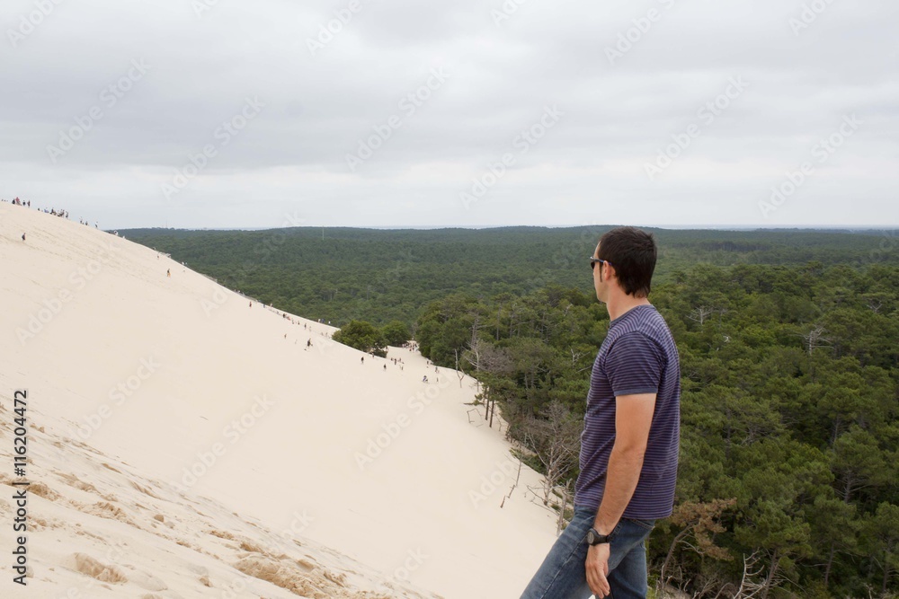 guy looking people going down the Pilat dune in France