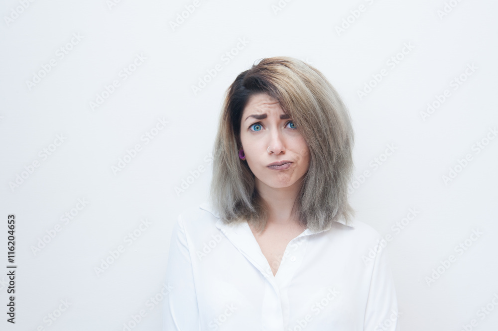 Young blue eyes blonde woman doubtful face Young blue eyes blonde woman doubtful face