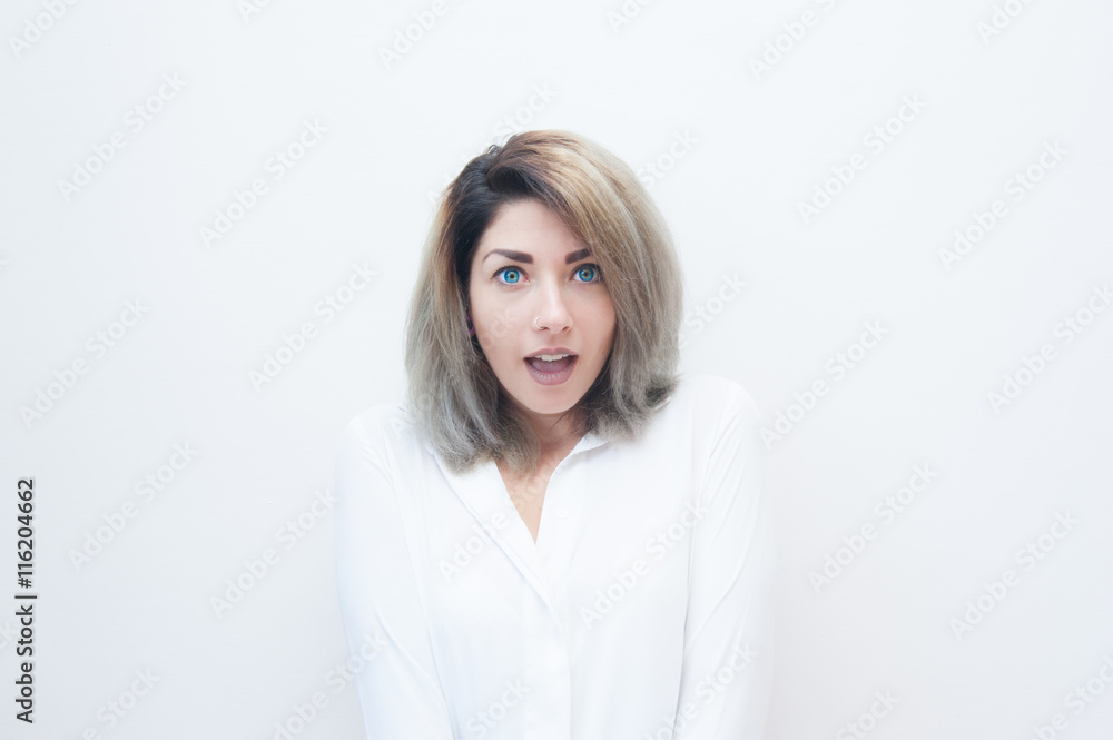 Young blue eyes blonde woman amazed expression Young blue eyes blonde woman amazed expression