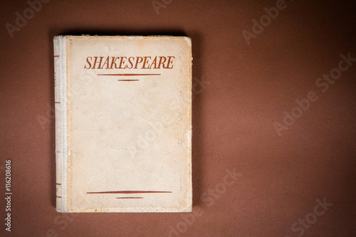 A Book by Shakespeare on Vintage Background