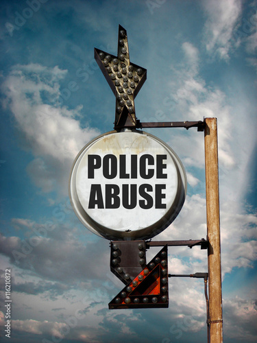 aged and worn vintage photo of police abuse sign