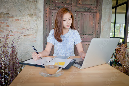 the Beautiful business woman using a laptop computer