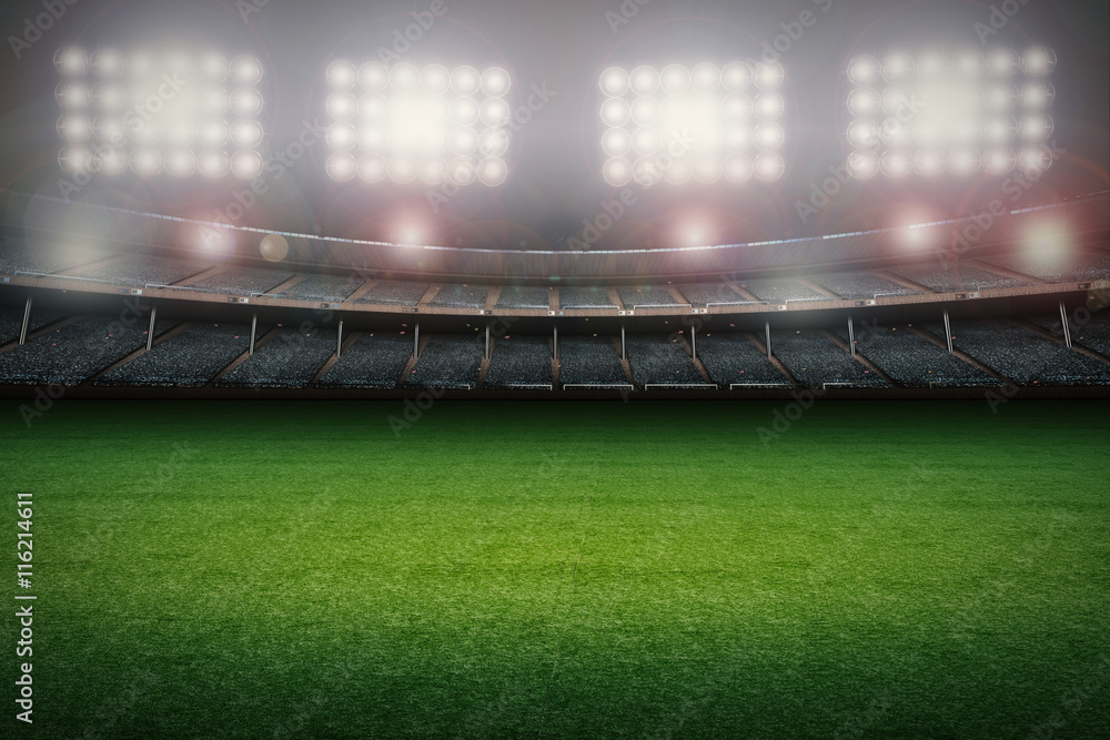 Obraz premium puste boisko do piłki nożnej ze stadionem w nocy