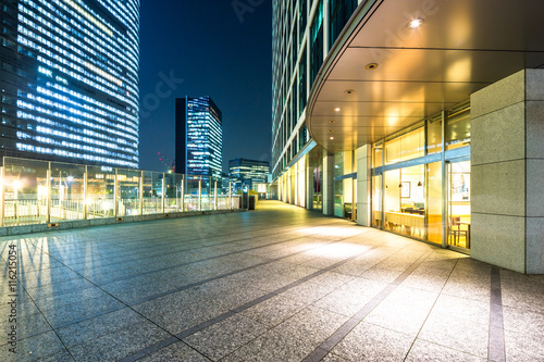 modern buildings in downtown of tokyo at twilight from empty foo