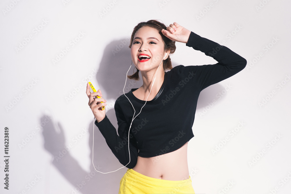 Fashion lifestyle portrait of young happy pretty woman listening Fashion lifestyle portrait of young happy pretty woman listening