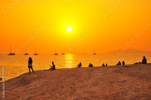 People on Sunset Beach © karinkamon