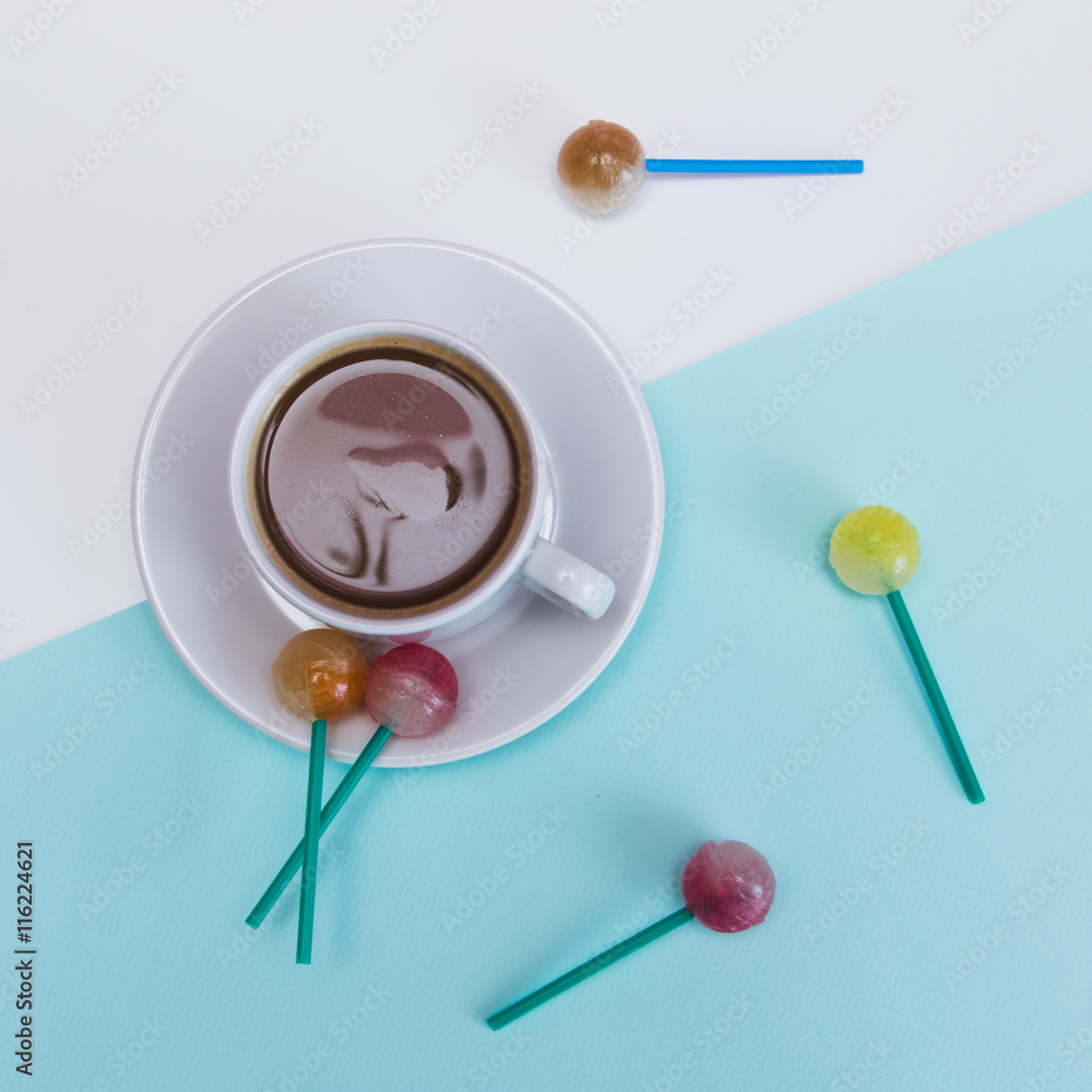 Cup of cacao and sweets on blue and white background Cup of cacao and sweets on blue and white background