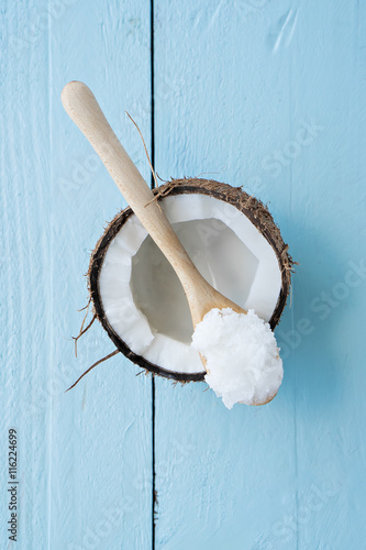 coconuts with coconut oil on table