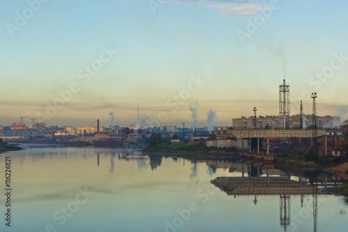 Cityscape with river and factory