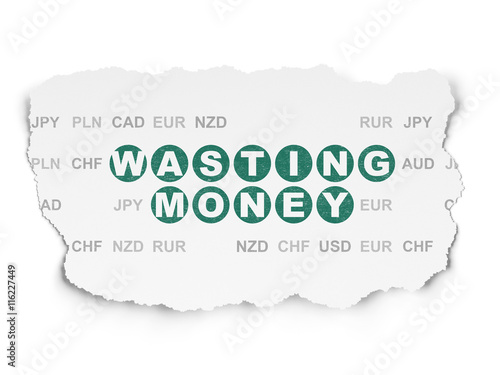 Currency concept: Wasting Money on Torn Paper background