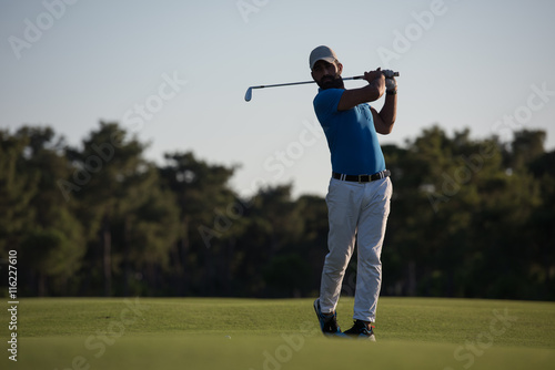 golfer hitting long shot