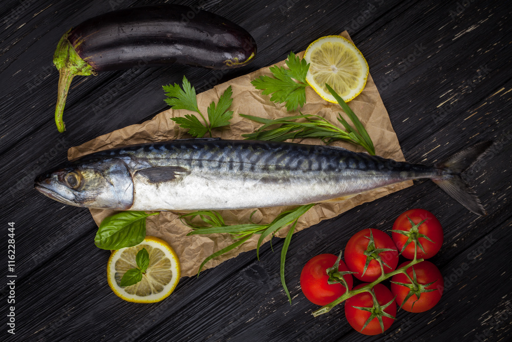 Mackerels served on parchment with lemon, tomatoes, eggplant, and herbs Mackerels served on parchment with lemon, tomatoes, eggplant, and herbs