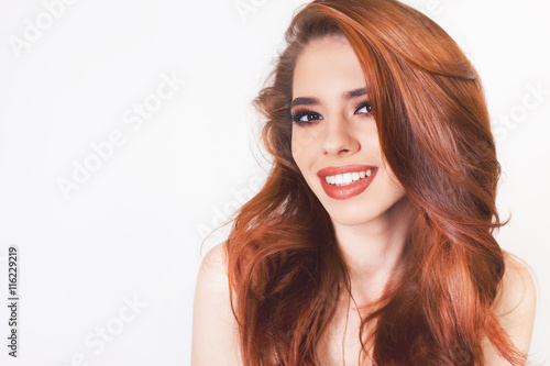 Pretty young woman with healthy perfect hair and white smile